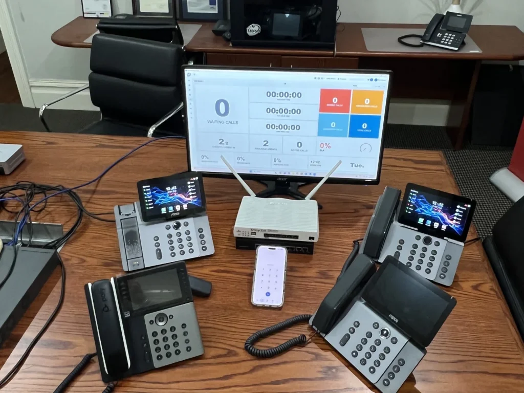 Phone system cards and handsets on the workbench at North Sydney